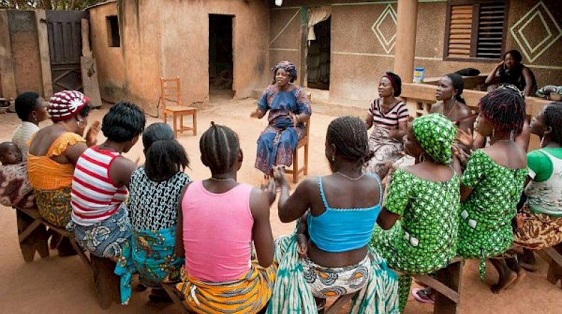 Volunteer Louise Lagni with a women's group in Doutin, Benin; Photo Credit: Johannes Ode